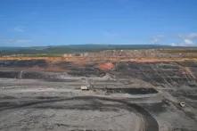 A huge coal mine with excavators looking small