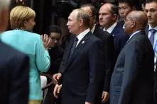Angela Merkel, Wladimir Putin und Jacob Zum auf dem G20-Gipfel 2016 in China