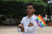 Joaquín Puerto with rainbow flag